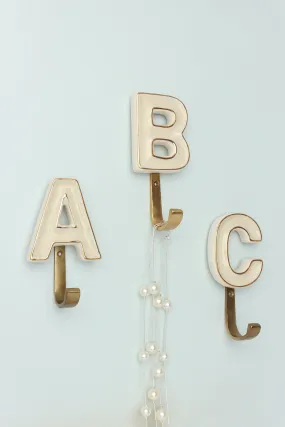 Alphabet Cream Crackle Glazed Hooks In Antique Brass